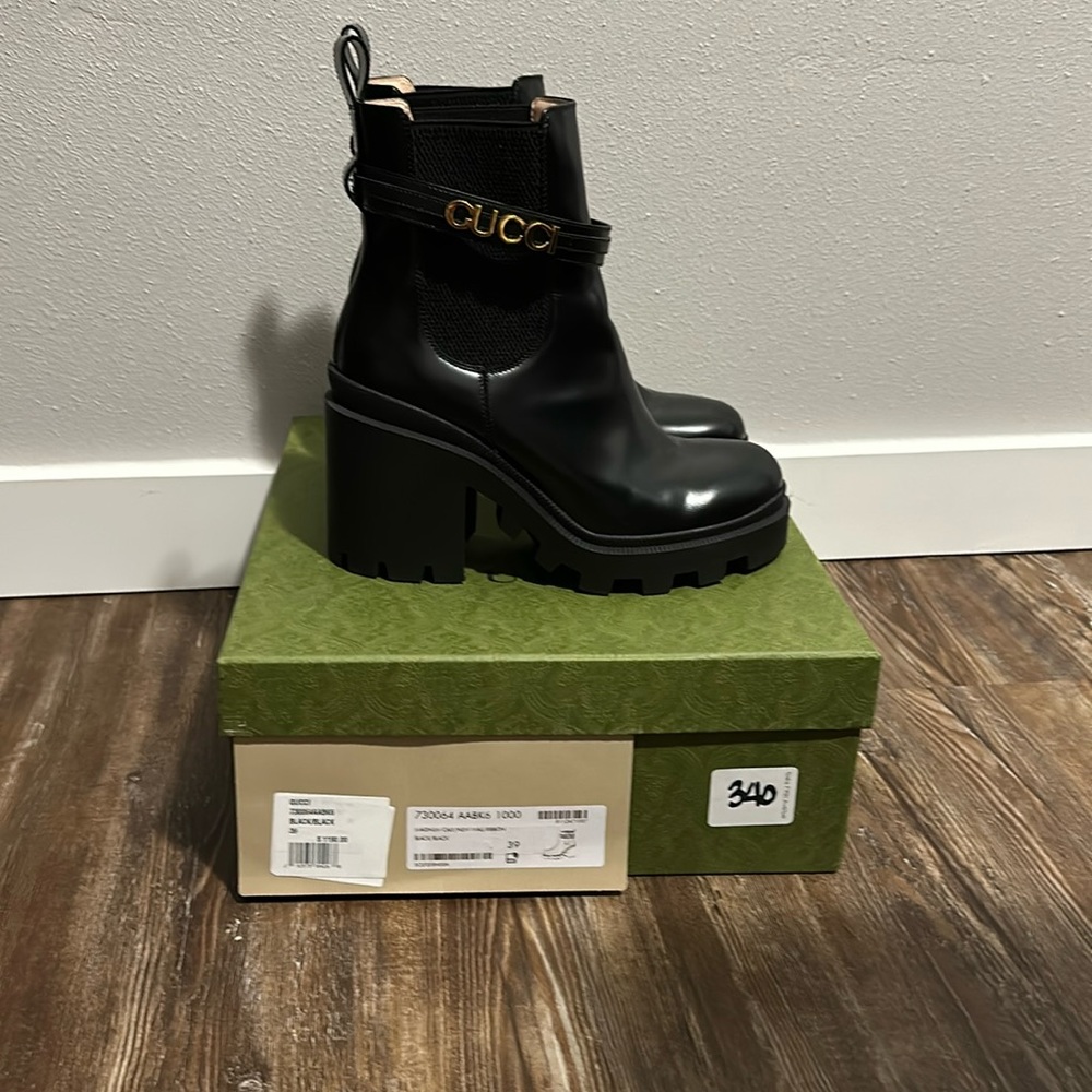 Black Gucci combat boots.